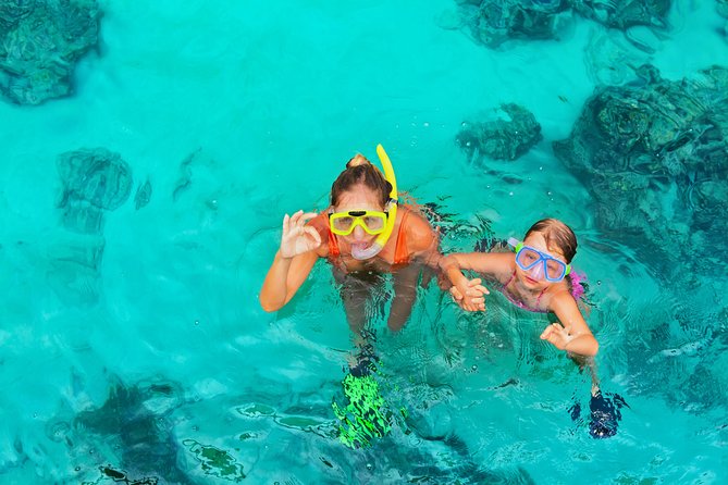 Bali Blue Lagoon Snorkeling Experience - Boarding the traditional jukung boat