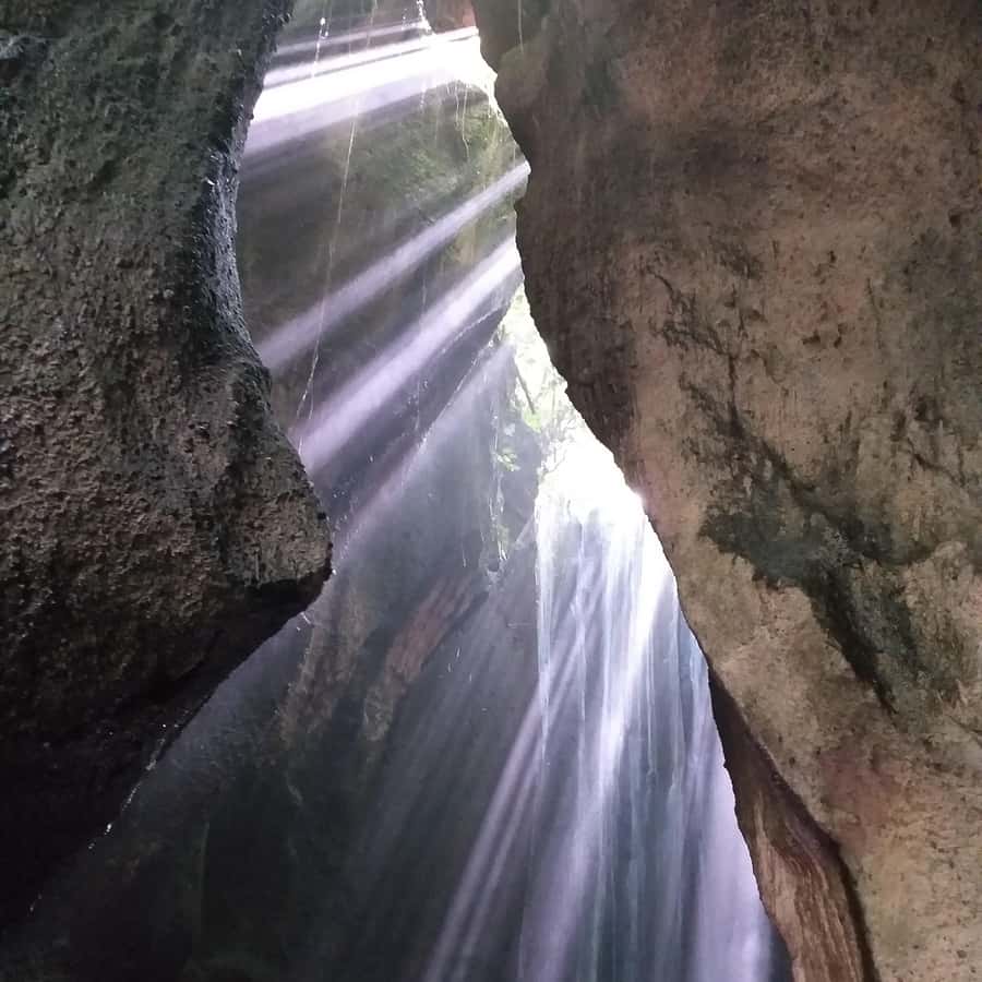 Bali: Tibumana, Tukad Cepung, Kanto Lampo, & Tegenungan Tour - Kanto Lampo: water over natural rock steps