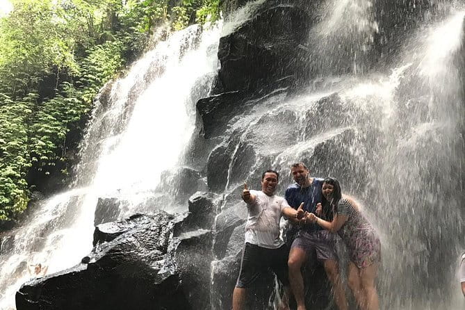 Bali Waterfall in One Day Tours, Hidden Waterfall - All Inclusive - Kanto Lampo, dark rock and the first photo stop