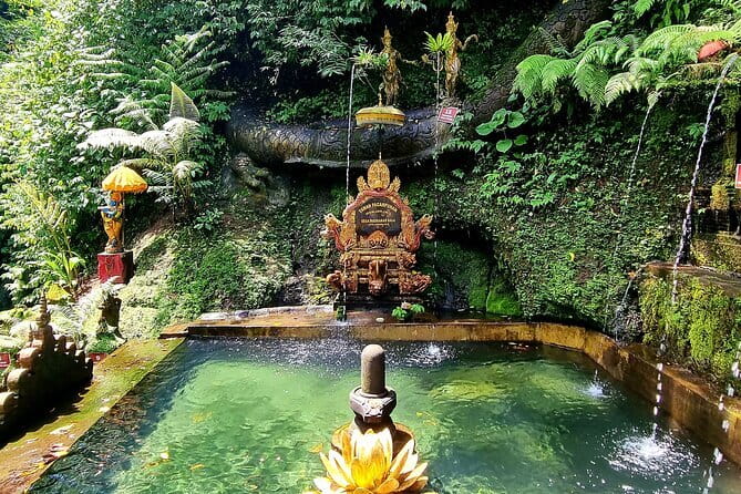 Melukat Purification Ceremony at Taman Pecampuhan Sala Temple - The cleansing bath beneath the waterfalls