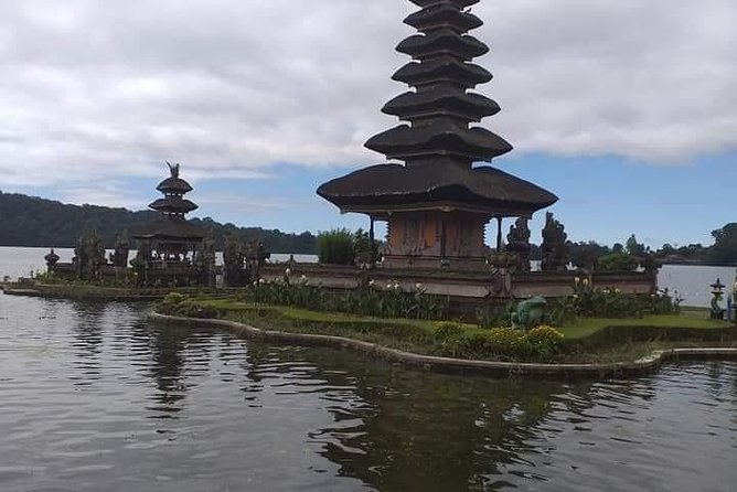 Notherm charm with sunset on the beach and temple - Ulun Danu Beratan beside the lake