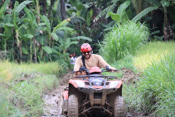 Ubud ATV Quad Bike with Ayung River Rafting Experience - Quad biking through tunnels, rice fields, and waterfalls
