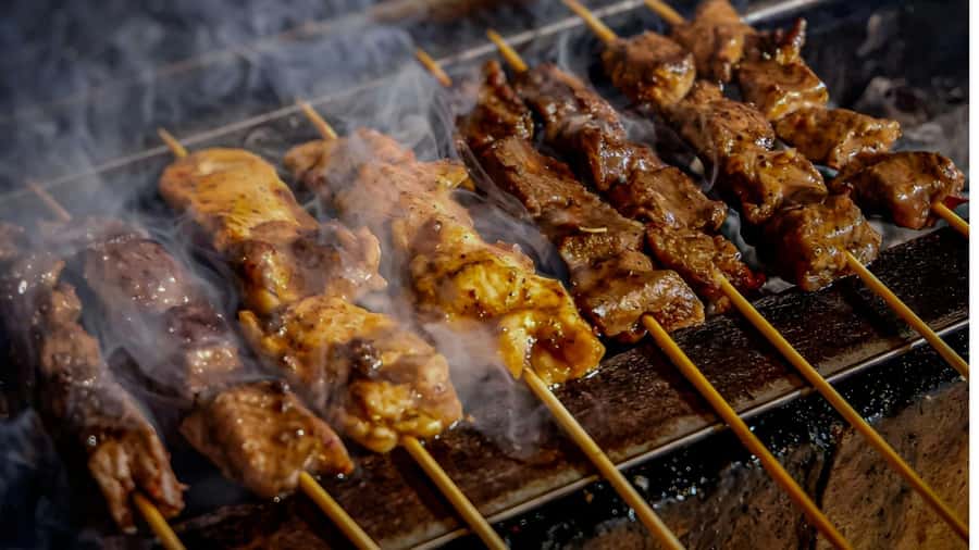 Ubud: Gianyar Night Market Food Tour with up to 17+ Tastings - Satay lilit starts the meal with lemongrass smoke