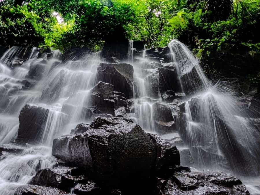 Ubud: Hidden Gems and Waterfalls Private Tour - Goa Raja Waterfall enters a cave