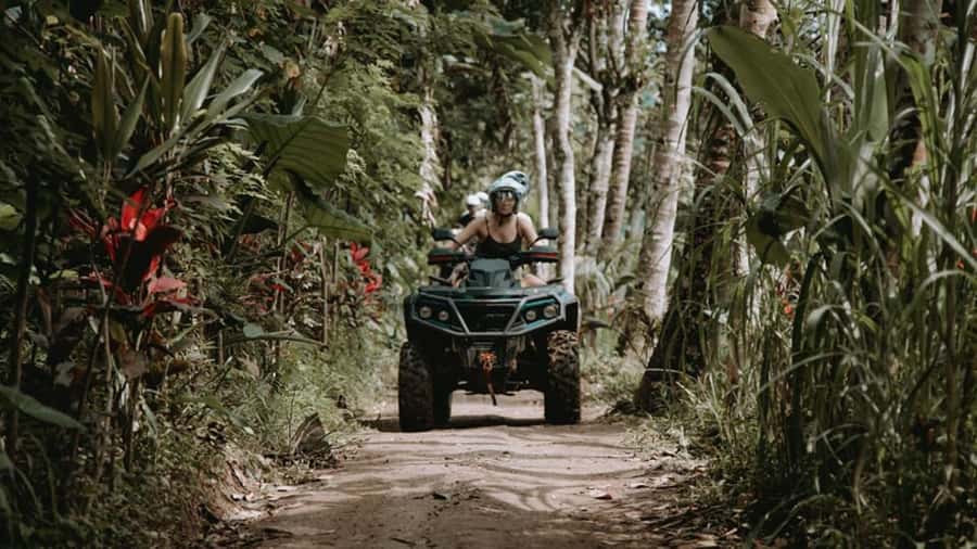 Ubud: Jungle ATV Adventure Waterfall Gorilla Cave and Lunch - Reaching the waterfall through moving water