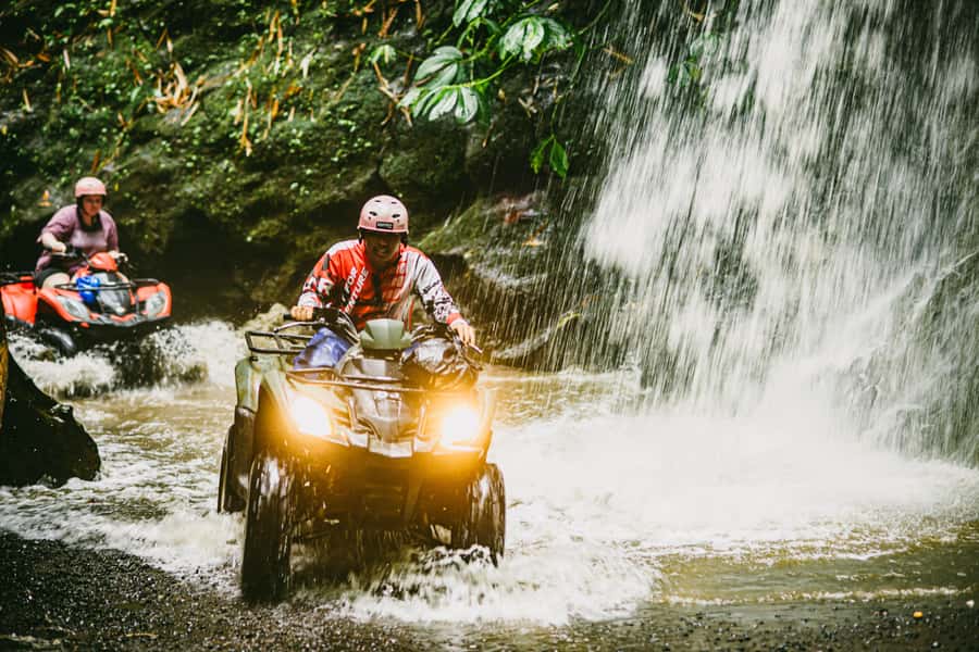 Ubud Quad Bike Tour with Waterfall, Long Tunnel, and Lunch - Muddy rivers and rocky ground test your nerve